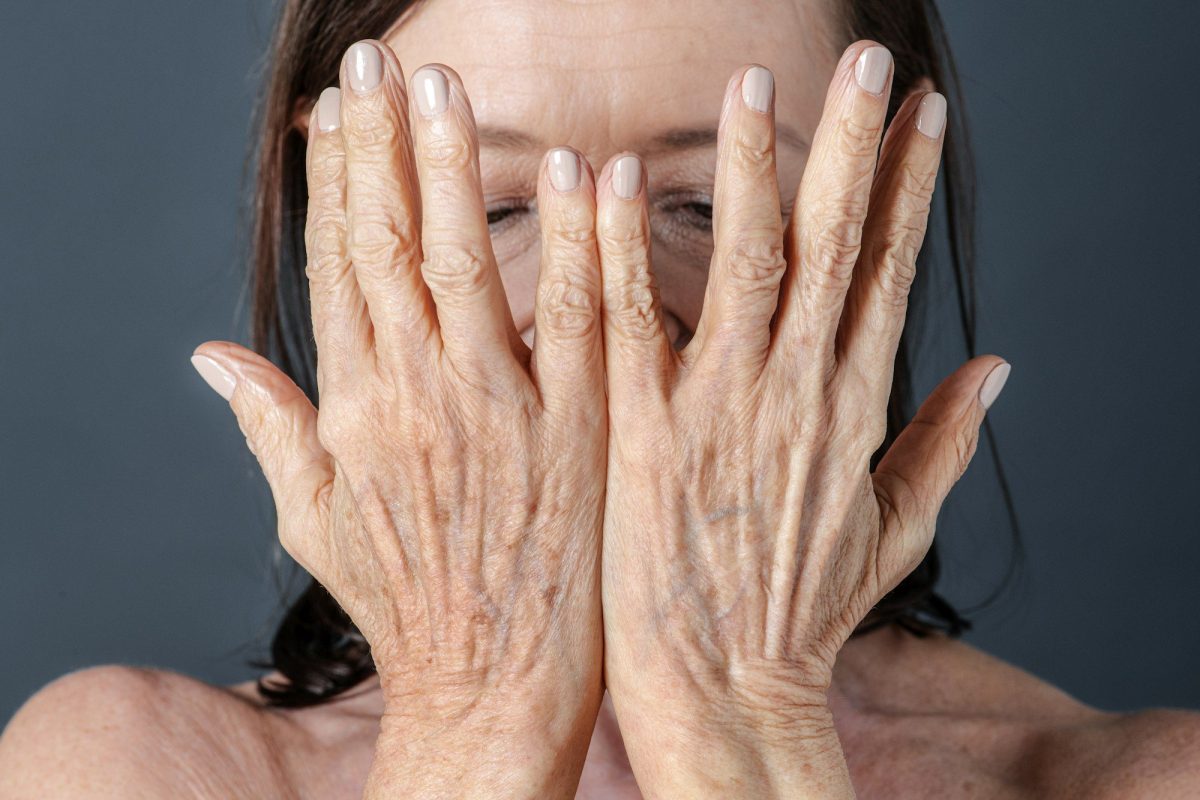 Close up of a senior woman with aging hands
